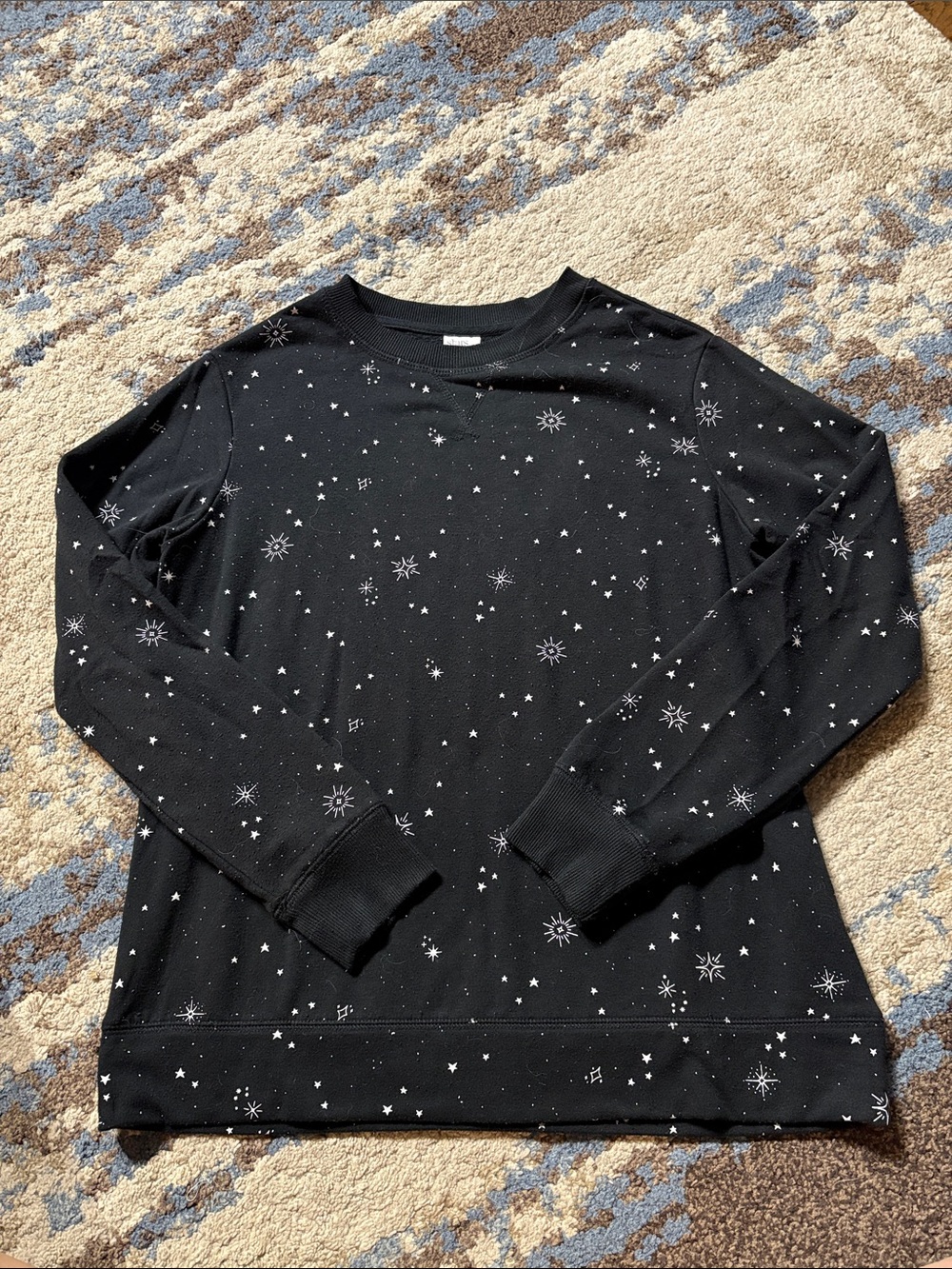 stars above Black Long-Sleeve Sweatshirt with White Star & Snowflake Print